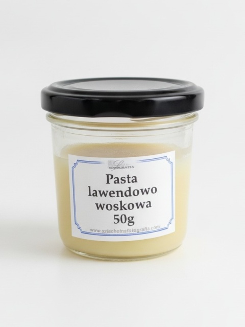 Glass jar with a black screw cap containing 50 g of lavender beeswax polish with manufacturer label on a white background – protective photo print finish.